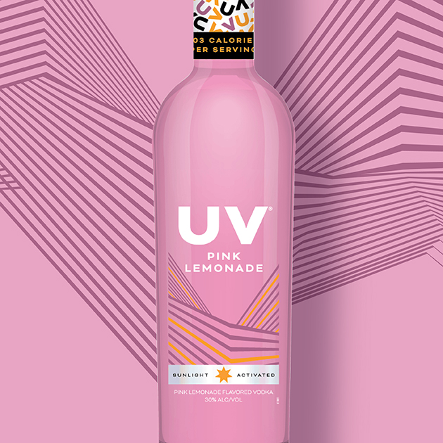UV Vodka bottle on a pink patterned background.