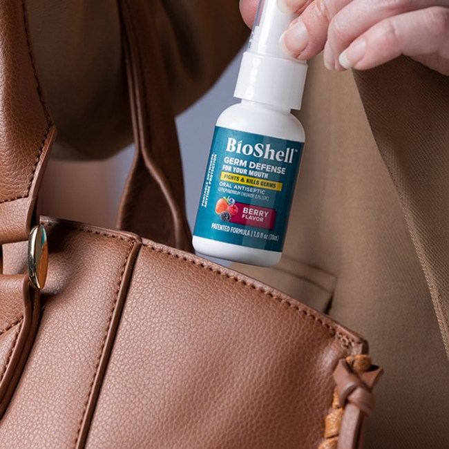 BioShell Wellness product being placed inside of a woman's purse.