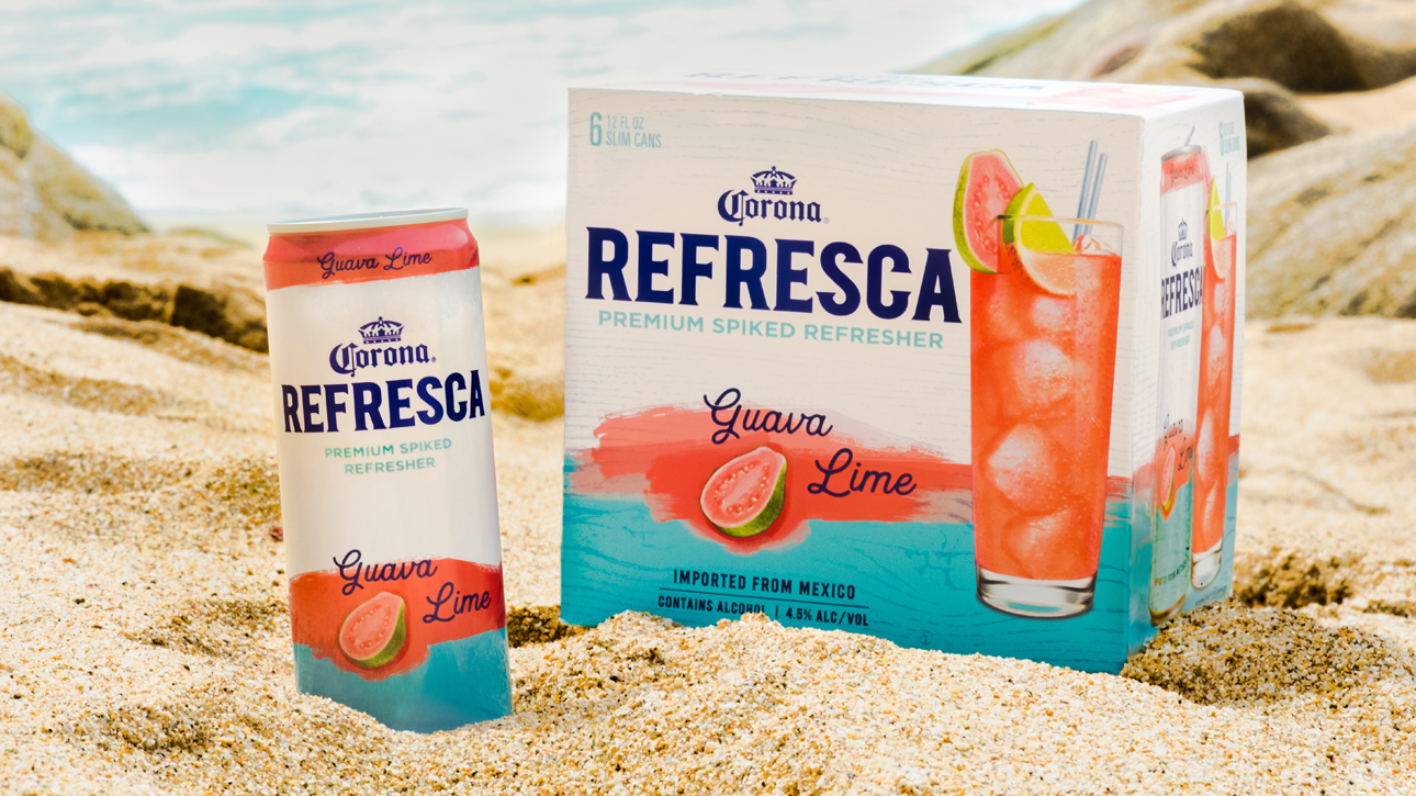 Corona Refresca guava lime can and box packaging in the sand.