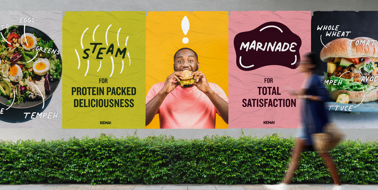 A person walking by a Kema advertisement.