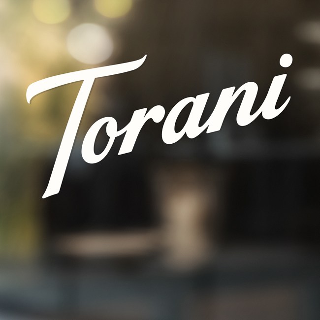 Torani logo on glass.