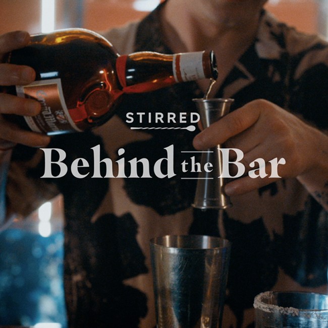 Behind the Bar with Stirred and Campari Brands bartender with logo lockup.